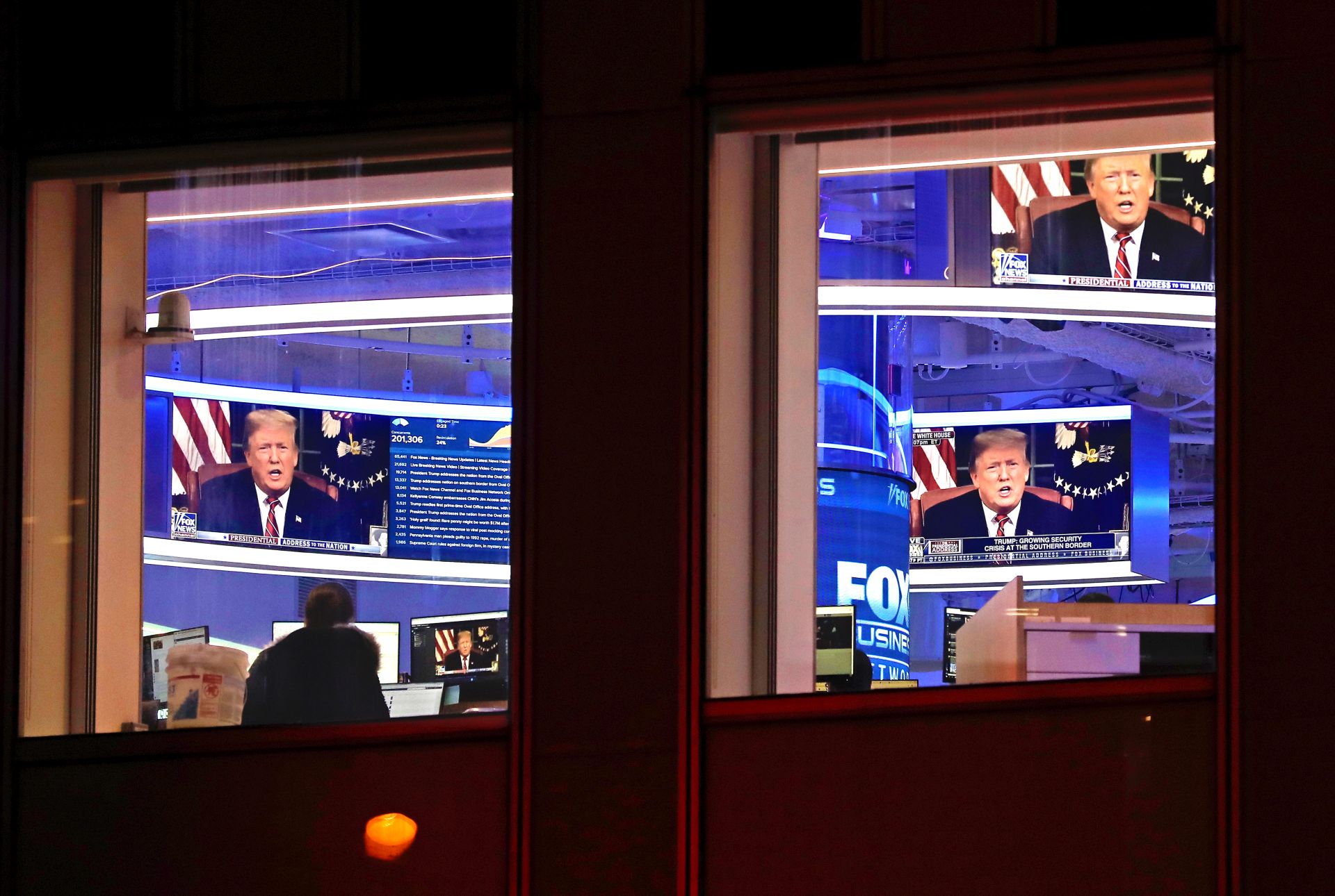 A split screen showing a Fox News broadcast and a portrait of Donald Trump.